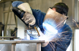 Image of man welding