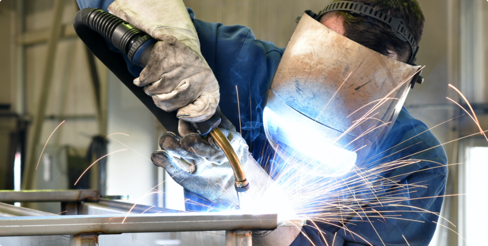 Image of man welding